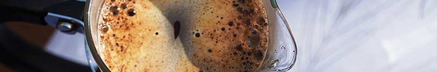 Close up of a cafetiere with coffee in it