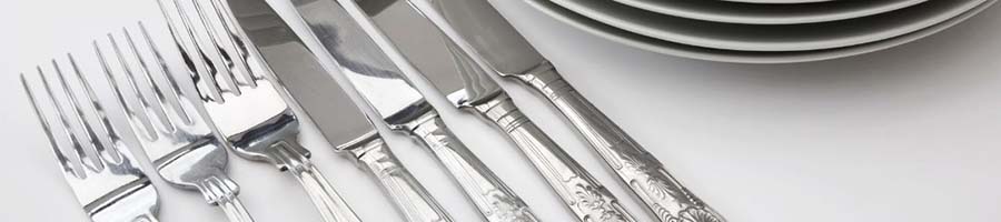 Cutlery lined up on a table