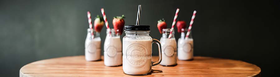 Row of milkshakes on a table